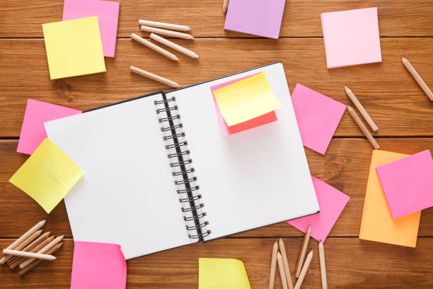 istock Top view of blank notepad on wooden office desk 837220286