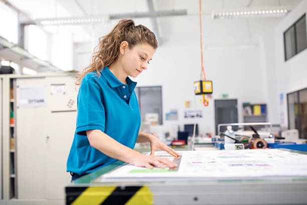 istock Female designer working at printing press 837226510