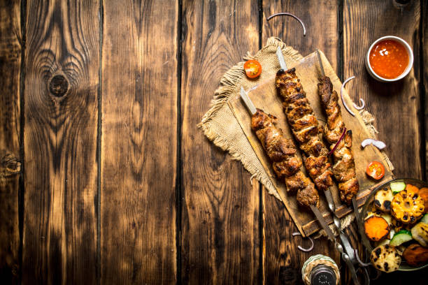 istock Grilled vegetables with a fragrant Shish kebab from mutton. 837234938