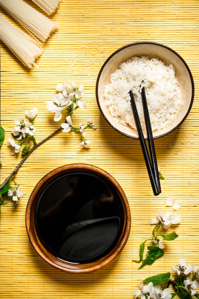 istock Boiled rice with soy sauce and the cherry branches 837236022