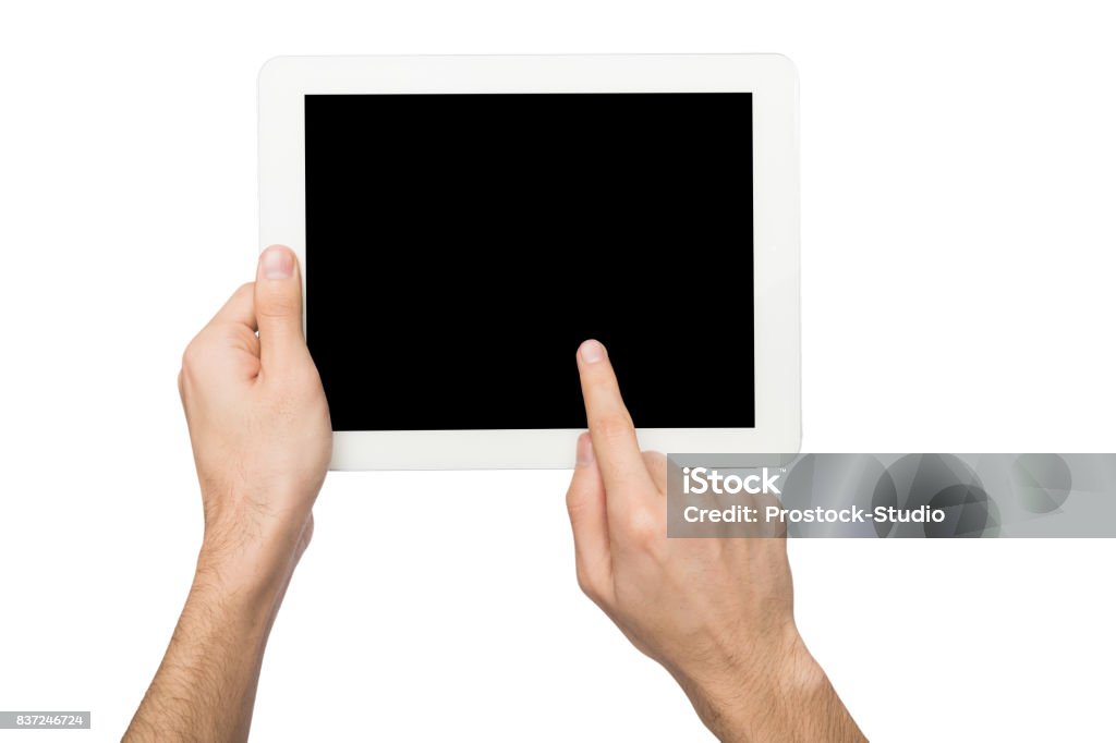 Man holding digital tablet with blank screen Closeup of man touching digital tablet display, cutout. Male hand holding digital tablet and pointing with index finger on blank screen, white isolated background, copy space Digital Tablet Stock Photo