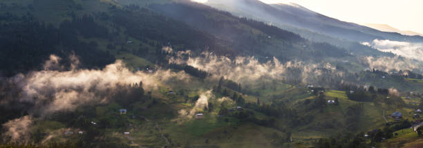 istock Misty village on the pass panorama. 837260786