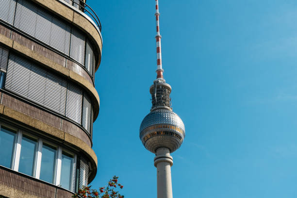 istock tv tower at berlin next to an office building 837261192