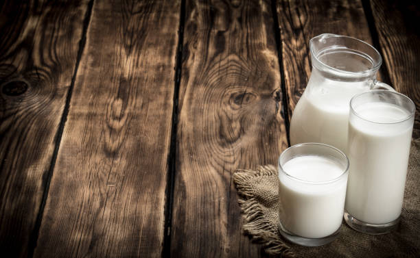 istock Fresh milk in jug and glasses . 837261558