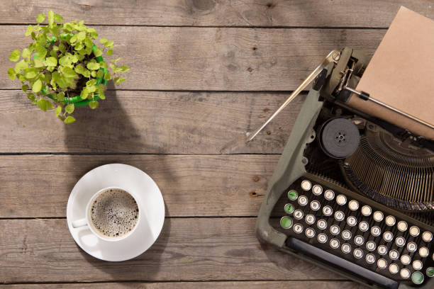istock Vintage typewriter on the old wooden desk 837262330