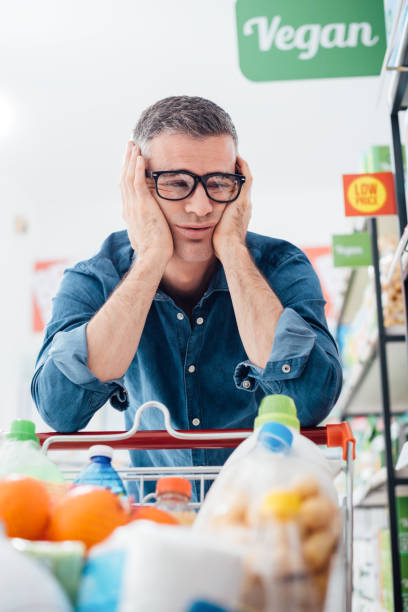 istock Sad man shopping at the supermarket 837274718