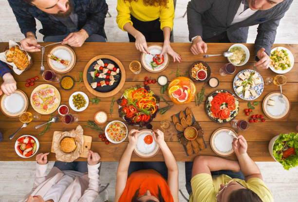 istock People eat healthy meals at served table dinner party 837280070