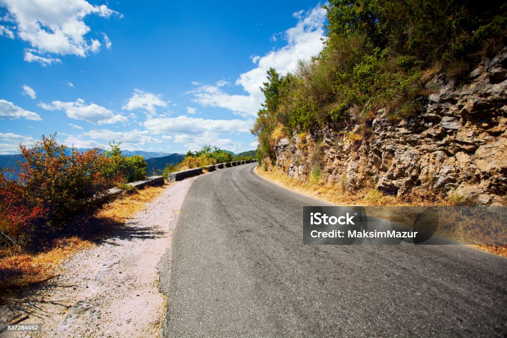 Paved road in the mountains far away Asphalt Stock Photo