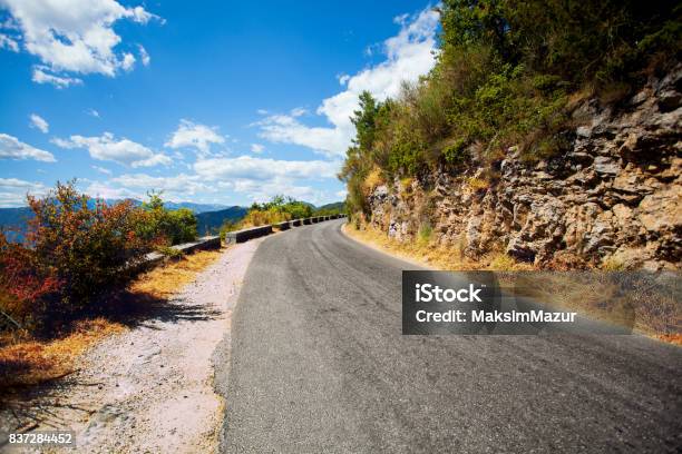 Paved Road In The Mountains Far Away Stock Photo - Download Image Now - Asphalt, Car, Curve