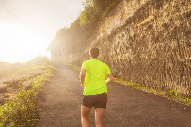 istock Jogging / running up the hill at sunset / sunrise. 837284496