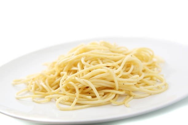 istock Spaghetti noodles isolated in white background 837290098