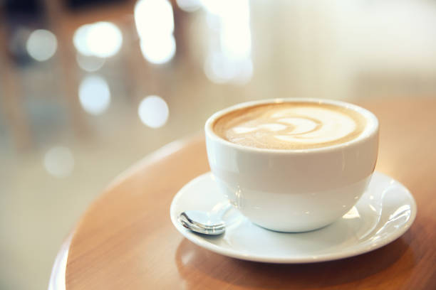 istock cappuccino coffee on wood background 837290240