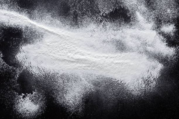 istock Baking concept on black background, sprinkled flour with copy space 837290456