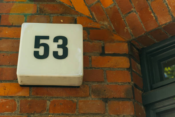 istock door number 53 on brick wall 837290606