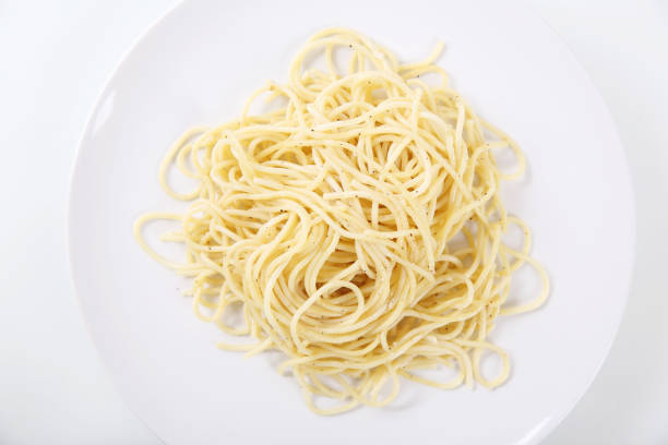 istock Spaghetti noodles isolated in white background 837291612