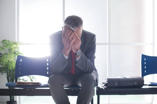istock Desperate businessman in the waiting room 837292428