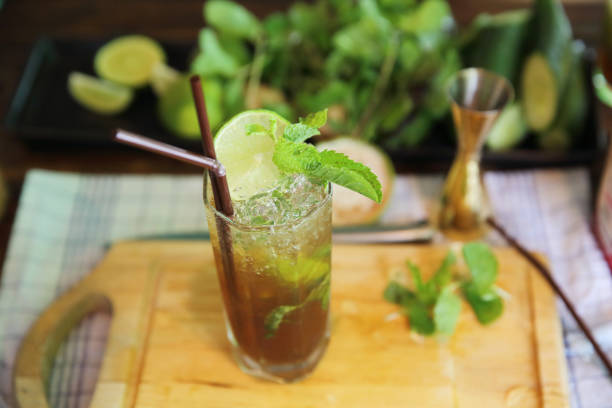 Mojito cocktail drink with mint and lemon background