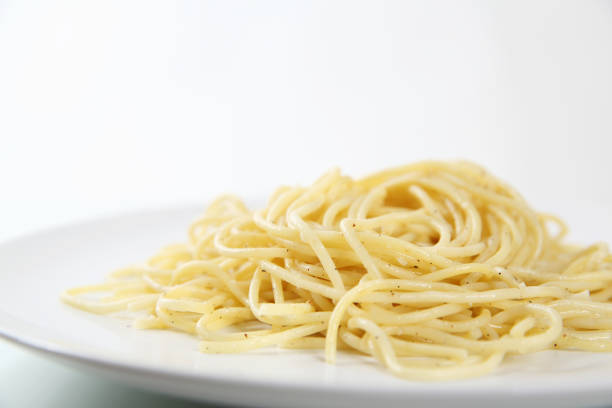 istock Spaghetti noodles isolated in white background 837293232