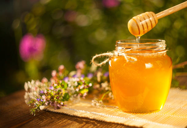istock Delicious delicious honey in  jar on table 837299284