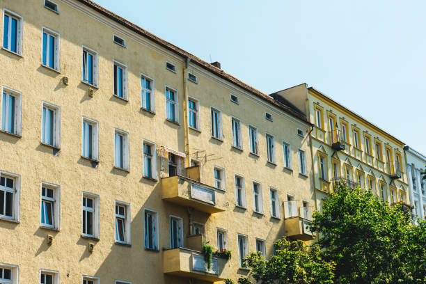 istock yellow apartment houses in a row 837301346