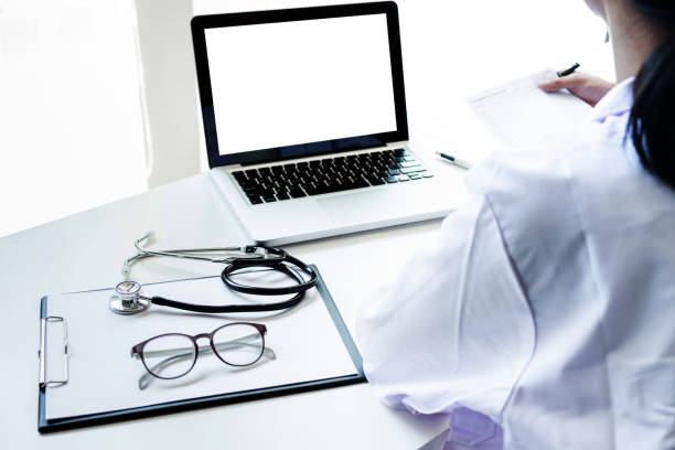 istock doctors being discussing patient history in an office pointing to a clipboard with document paper as they make a diagnosis or recommend on treatment 837303170