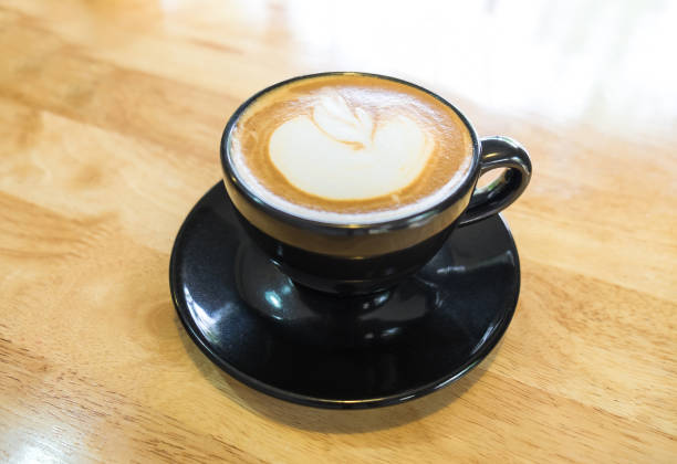 istock Coffee and cup on wooden table background 837307274