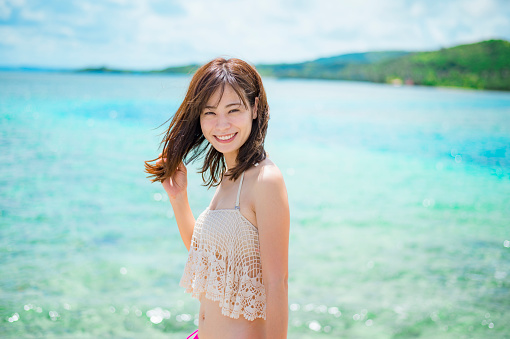 Japanese woman enjoying beach at Guam