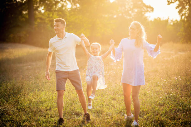 istock Parents playing with their daughter 837309104