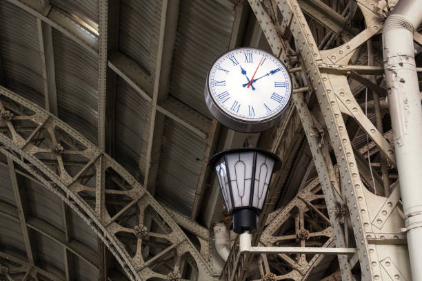 istock Waiting time clocks on train station. 837309138
