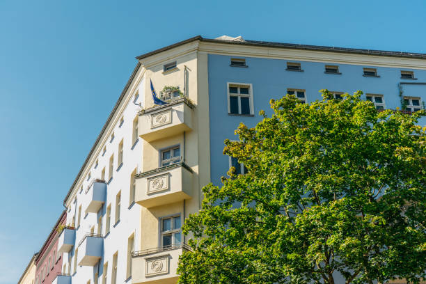 istock blue and yellow corner house on a summer day 837315388