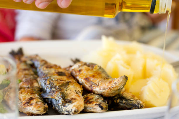 istock grilled sardines with boiled potato on white dish 837320952