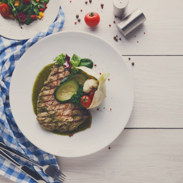 istock Grilled beefsteak with vegetables and green bell pepper sauce 837322136