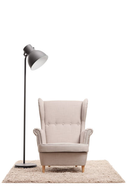 istock Classic armchair and a modern lamp on a carpet 837326940