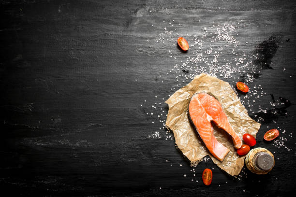 istock Raw salmon with tomatoes and salt. 837328760