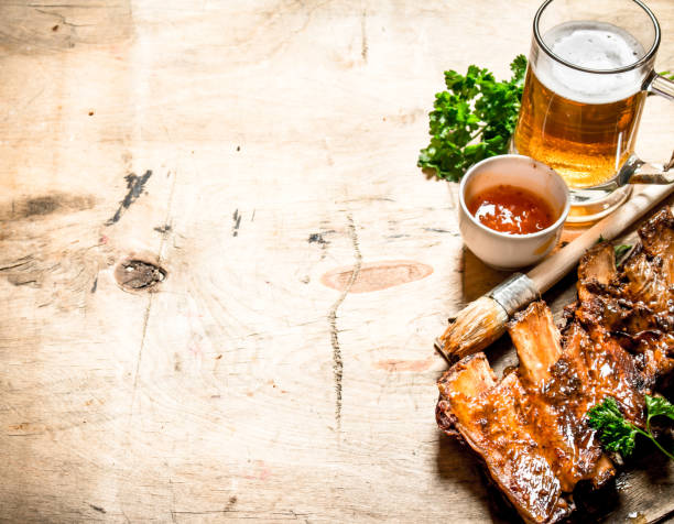 istock Barbecue pork ribs with tomato sauce and beer. 837329054