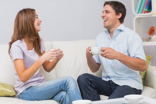 istock Cheerful couple enjoying their tea at home 837336202