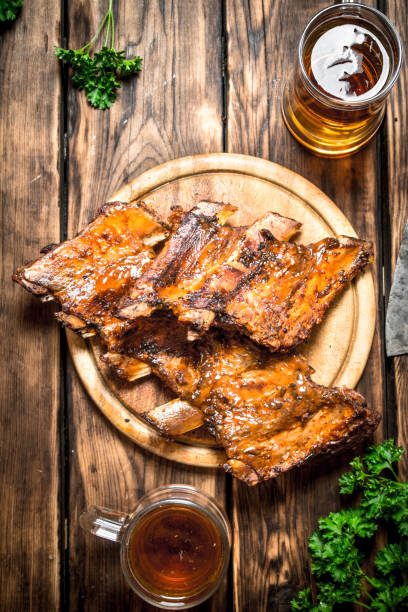 istock Smoked ribs grilled with beer and parsley. 837337072
