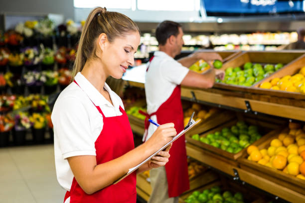 istock Grocery store staff with clipboard 837339066