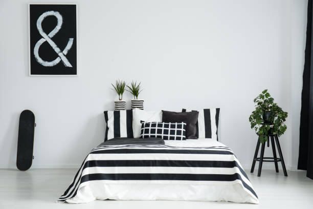 istock King-size bed between skateboard and plant 837345000