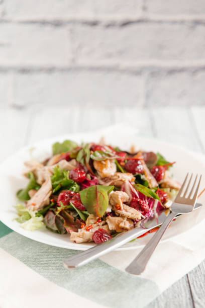 istock Chicken, cherry tomatoes and spinach salad 837345024