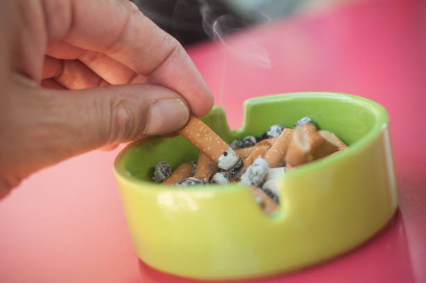 istock Hand crushing a cigarette in an ashtray 837352222