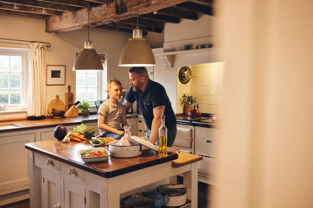 istock Father and son in kitchen at home 837354380