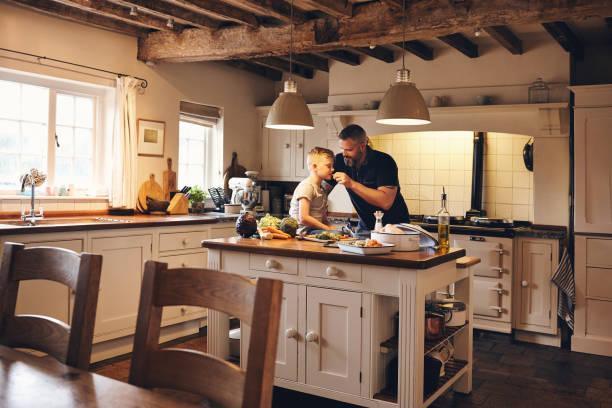 istock Father and son having fun in the kitchen 837354388