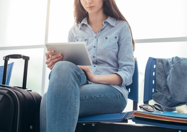 istock Woman connecting in the waiting room 837359396