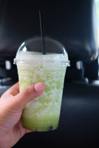 istock Healthy smoothie with pineapple and mint in young man hand 837369508