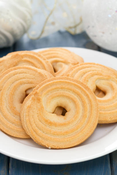 istock cookies on white dish on blue wooden background 837370950