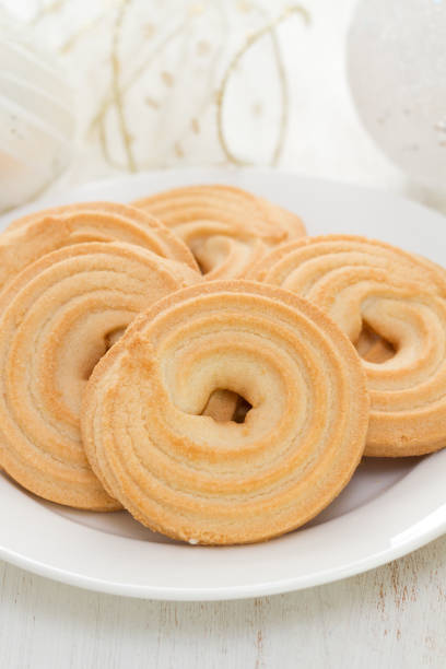 istock cookies on white dish on white wooden background 837371034