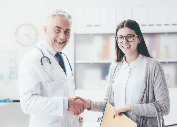 istock Doctor and patient shaking hands 837385254