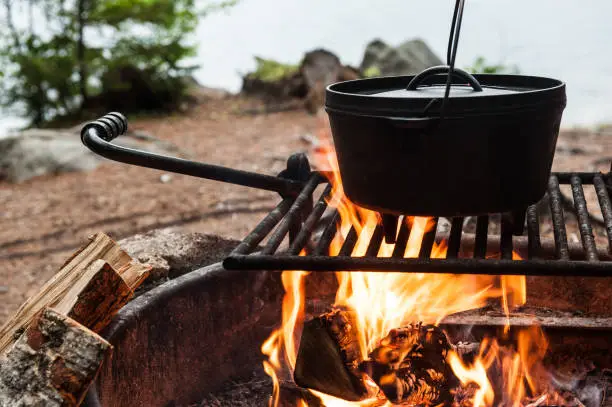 Photo of Dutch oven cooking over a campfire
