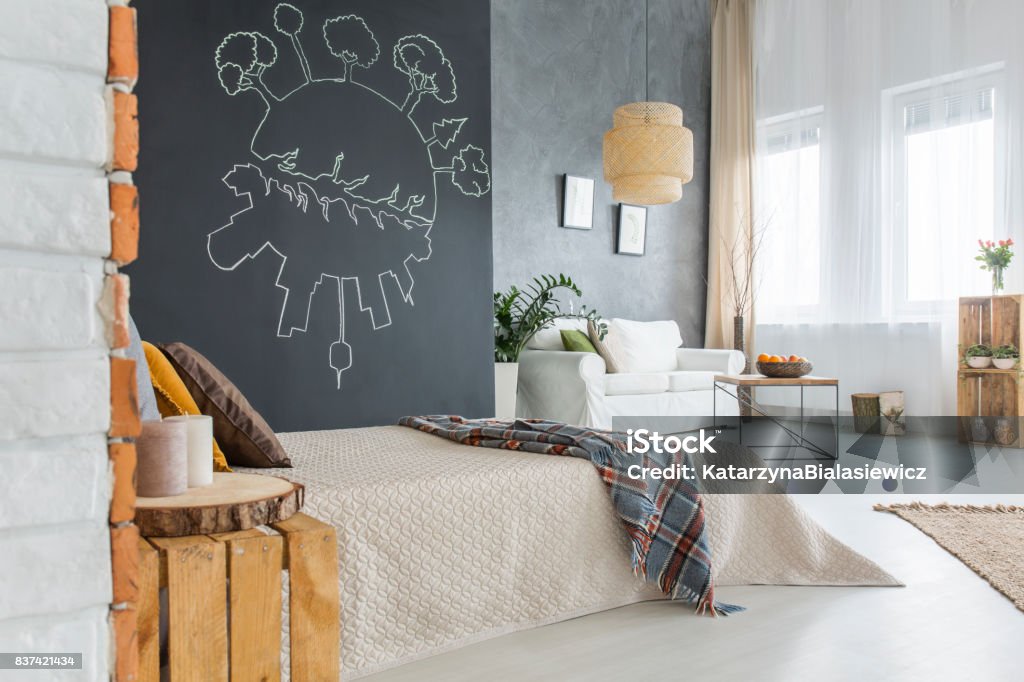 Bed with blanket Modern bedroom with white comfortable bed with blanket on it Apartment Stock Photo